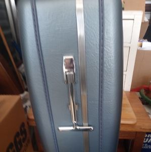 2 suit cases hard shell handles and wheels